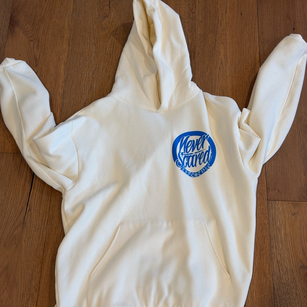 Cream Hoodie with Blue 'Never Scared' Logo